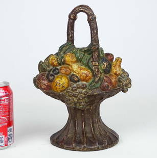 Doorstop: Early cast iron fruit basket doorstop. Albany Foundry. Reference: The Doorstop Book, Smith. p. 75. 11" Ht..