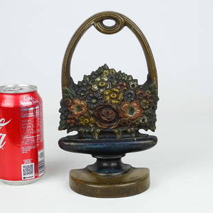 Doorstop: Bradley & Hubbard cast iron flowers in urn doorstop. Marked B & H (Cat. 279-N). Reference: The Doorstop Book, Smith. p. 66. 9" Ht..