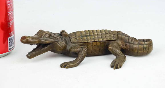 Early Brass Alligator Match Holder: C. 1890's brass alligator match holder. 7 1/2" L..