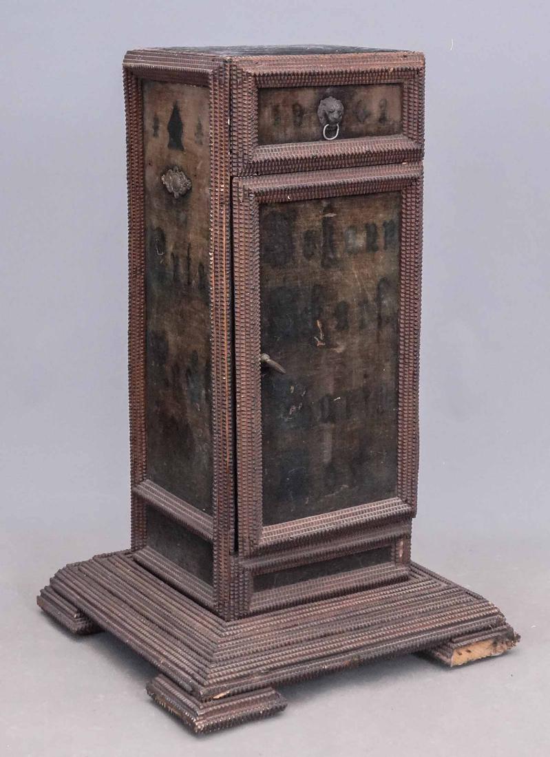 Tramp Art Pedestal: 19th c. tramp art pedestal with drawer and door. 18 1/2" x 17 1/2" x 30" Ht.. Front foot has some loss.