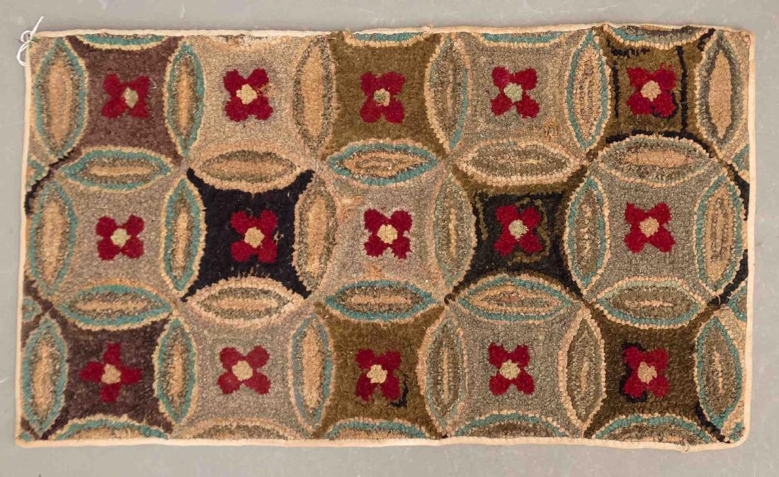 Hooked Rug: C. 1930's Double Wedding ring hooked rug. 18" x 31".
