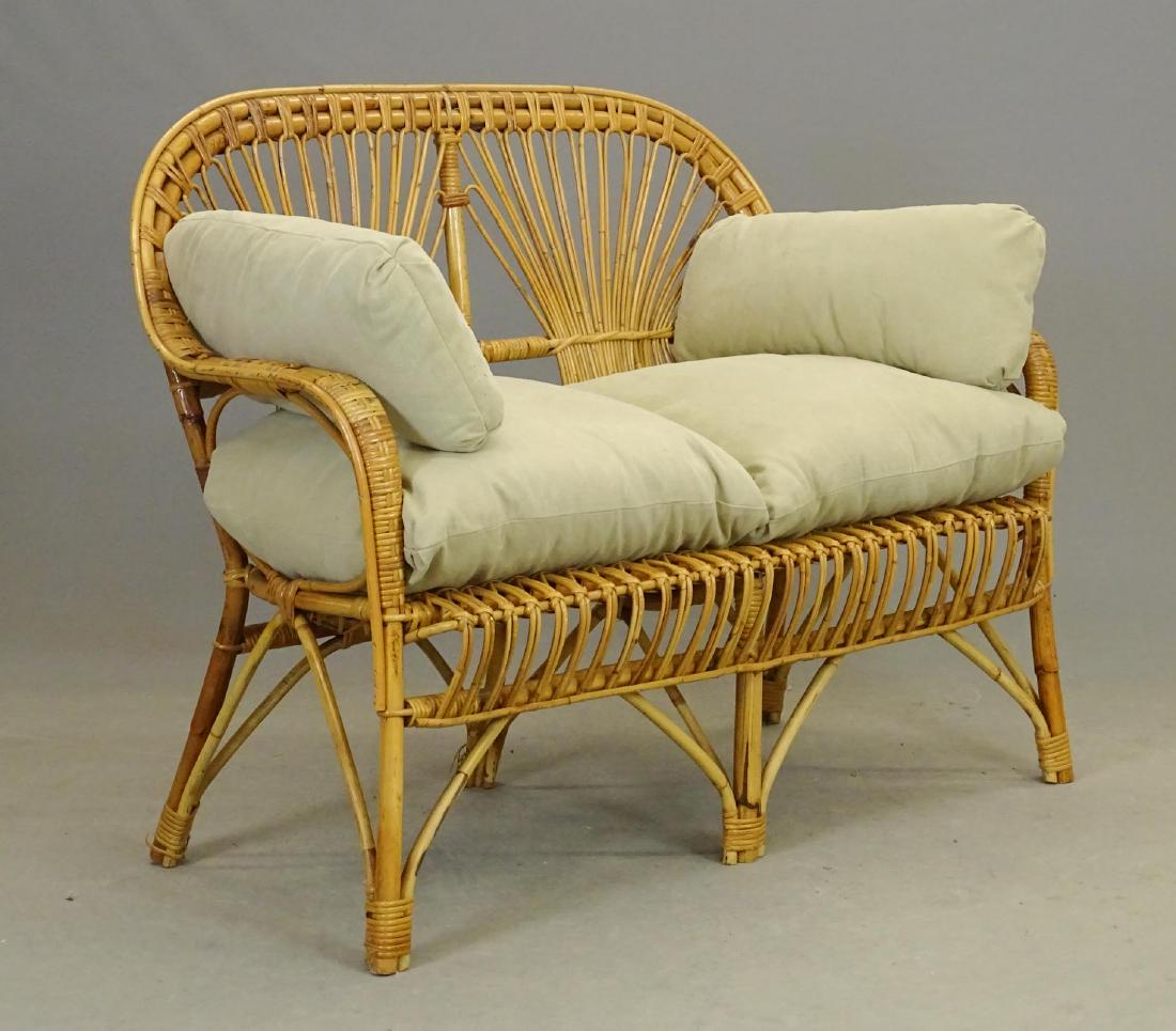 Settee: Bamboo settee with cushions. 46" W..