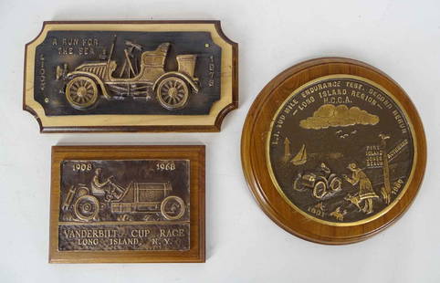 Bronze Plaques: Lot (3) bronze plaques. Designed by Peter Helck for 1968 re-run of the Vanderbilt Cup Race. Features #16 as on cover of the "Checkered Flag". Plaque is mounted on mahogany base and was only given to