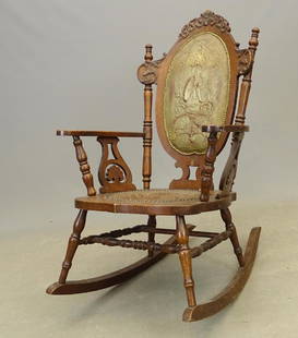 Victorian Rocking Chair With Bicycle Design: Rare oak Victorian rocking chair with pressed back with bicycle design. 17" seat Ht., 38" overall Ht.. Some loss to leather seat.