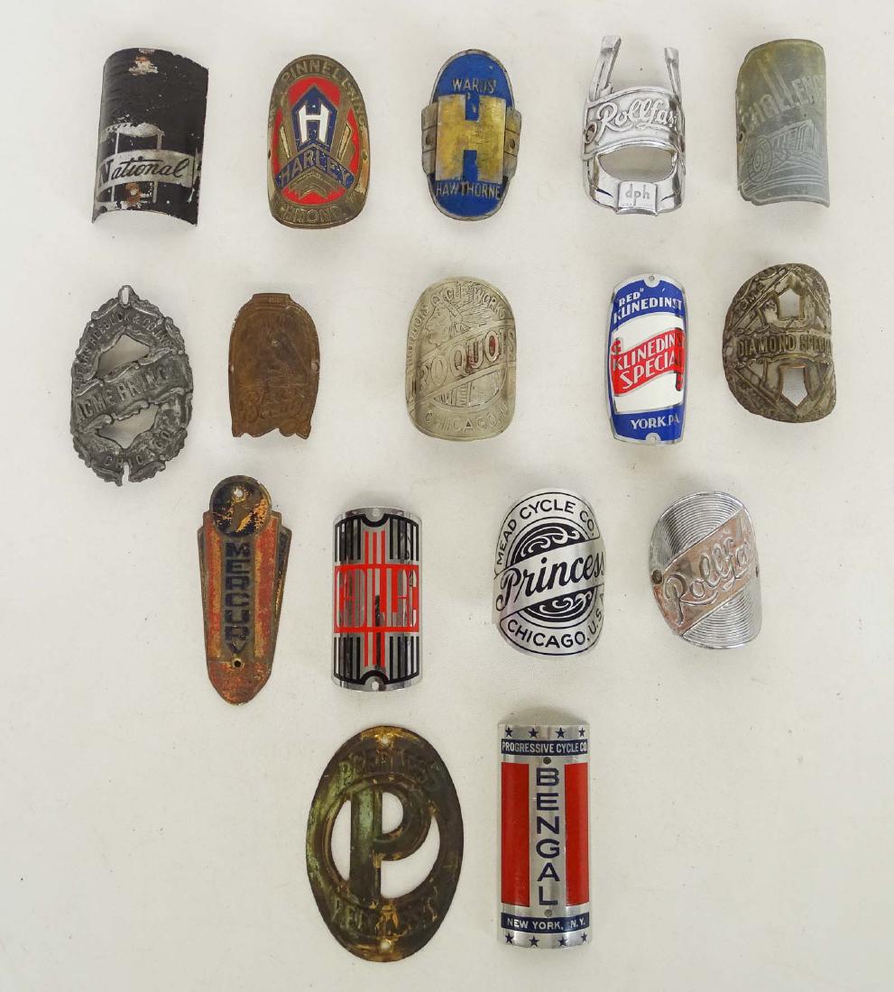 Bicycle Head Badges: Lot (16) various bicycle head badges. Includes Rollfast, Wards Hawthorne, Mead Prince, Diamond Special, Acme Prince, Iroquois etc.. Good condition.