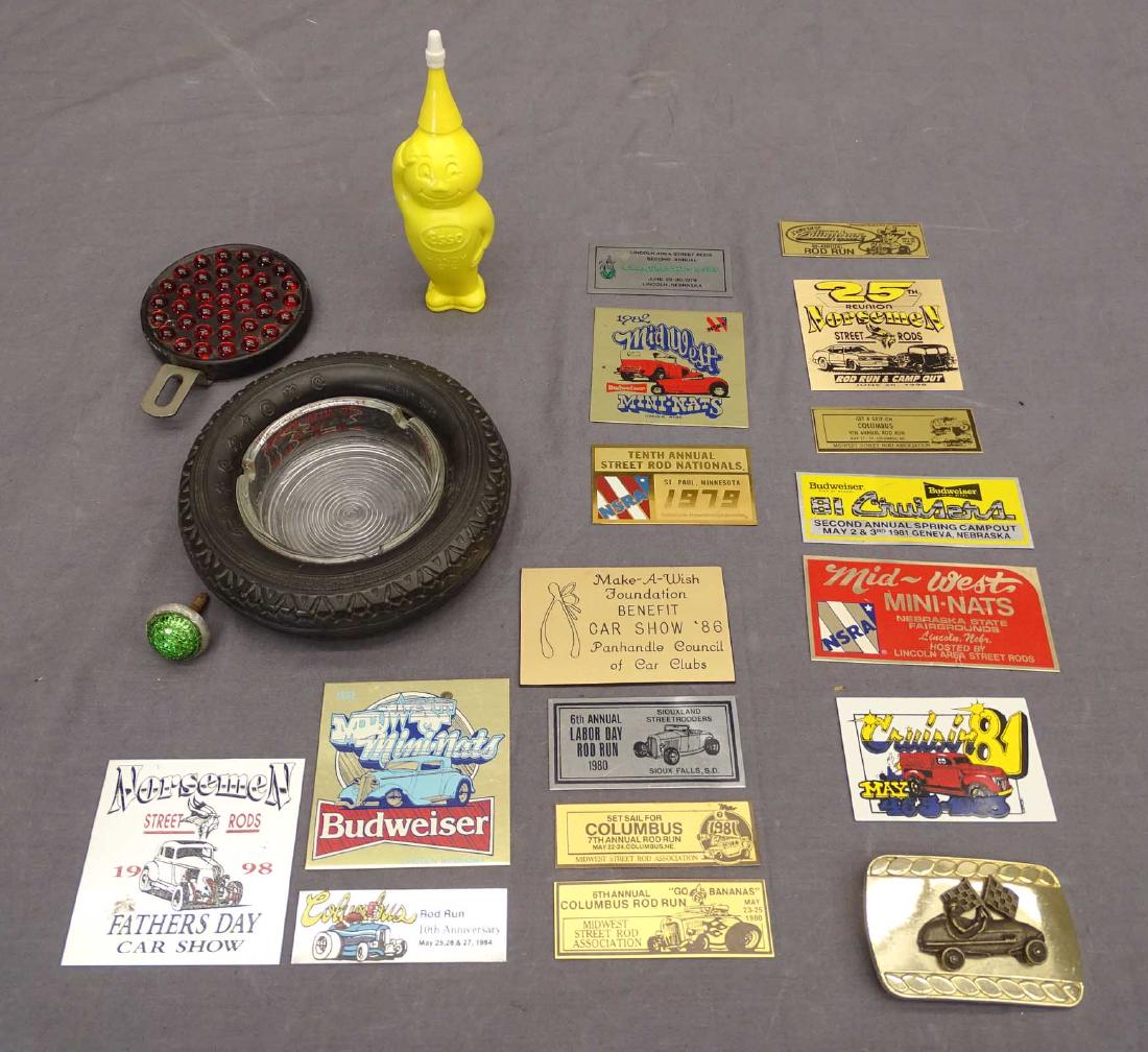 Misc. Lot: Misc. lot including vintage tire ashtray, (2) reflectors, (16) car meet reflectors, Midget racer belt buckle, vintage Esso oil dispenser figure (partial oil contents). Good condition.