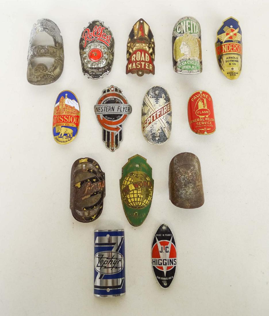 Bicycle Head Badges: Lot (14) various bicycle head badges. Includes Mead, Road Master, J. C. Higgins, Rowlett's, Zephyr, Spitfire etc.. Good condition.
