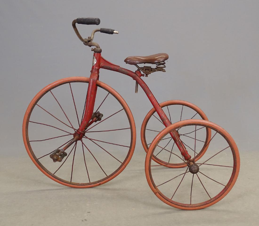 Early Child's Triycle: C. 1920's child's tricycle. Labeled "AMERICA / TOLEDO OHIO". Fair condition. Ex: Woodworth Collection.