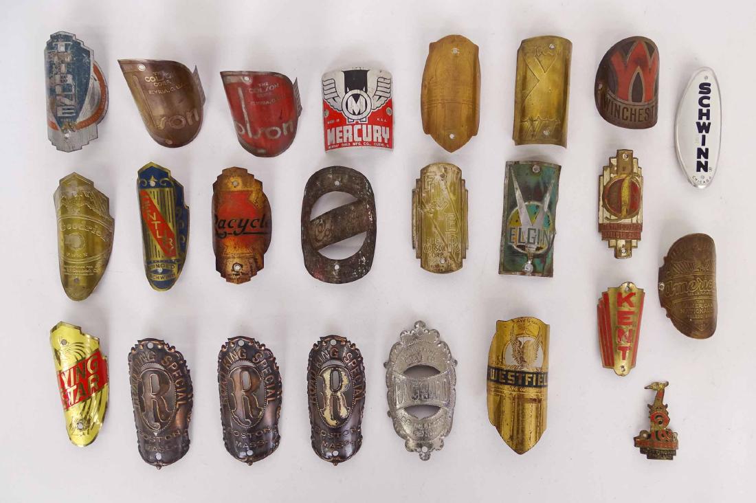 Bicycle Head Badges: Lot (24) early bicycle head badges. Includes B. F. Goodrich, Schwinn, Road King Special, Kent, Road King, Westfield etc.. Good condition.