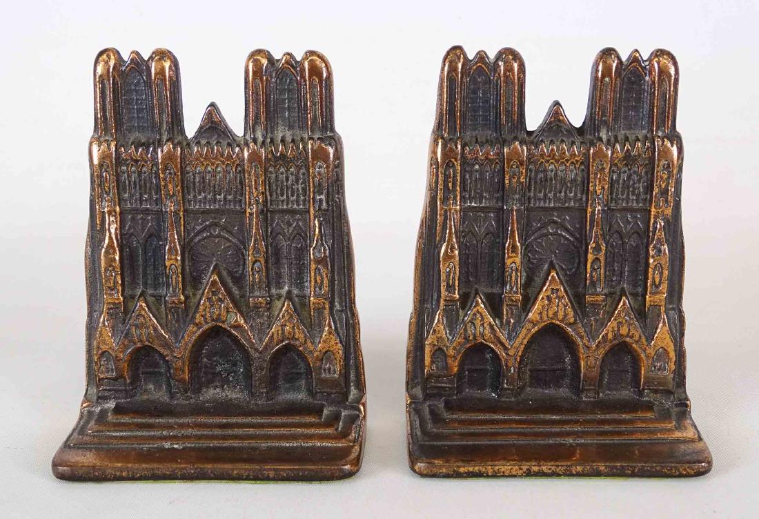 Bookends: Pair Notre Dame brass patina andirons. 5 1/2" Ht..