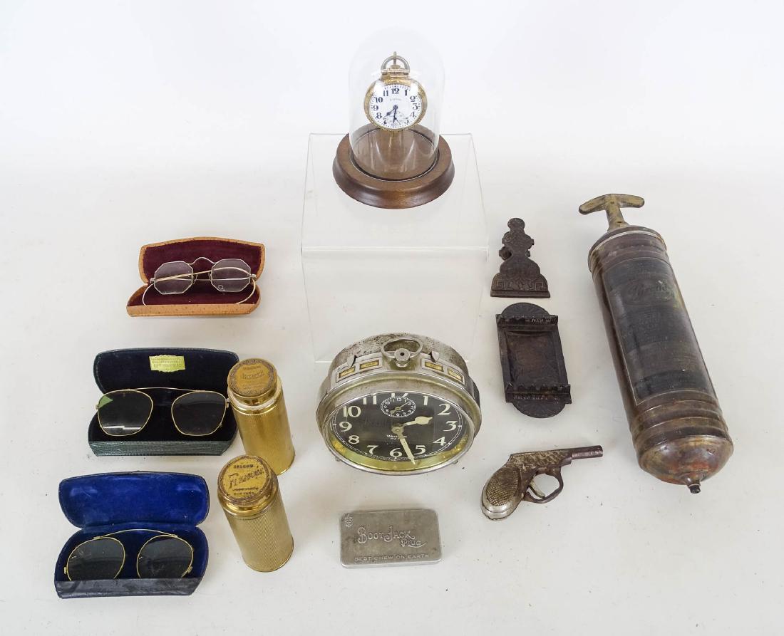 Misc. Lot: Misc. lot including Illinois pocket watch with dome case, Big Ben clock, USPO clipper and tray, (3) pair early cased glasses, early fire extinguisher, cap gun, Boot Jack plug case, (2) talcum containe
