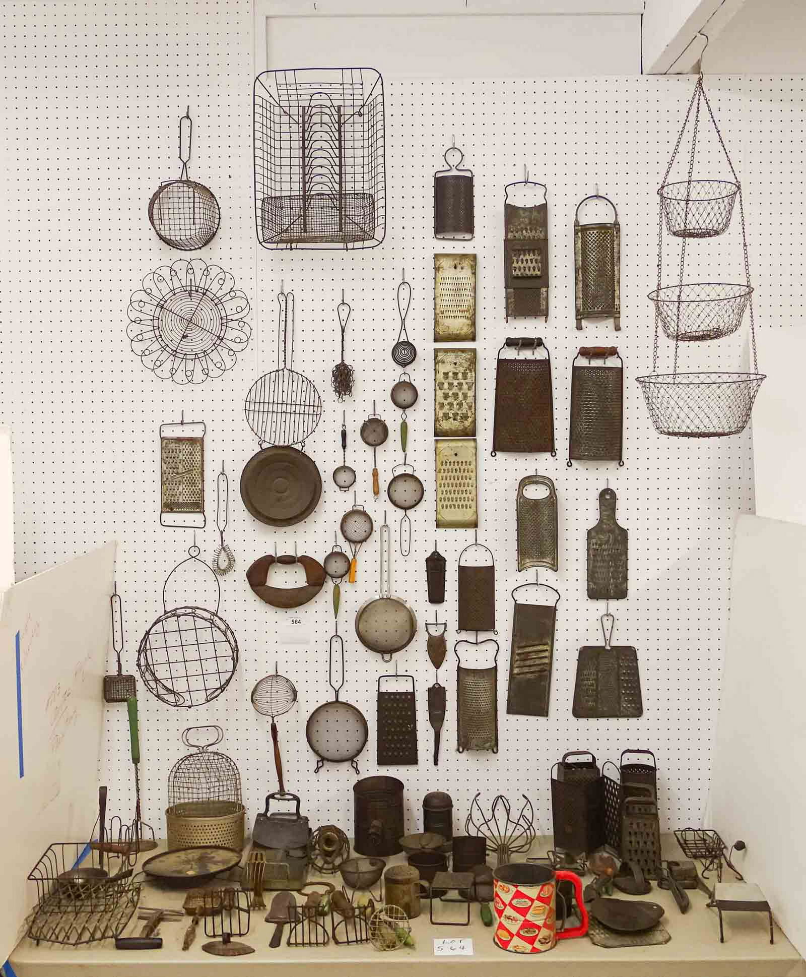 Misc. Lot: Misc. lot of antique and vintage kitchen primitives including over (20) cheese graters, choppers, sieves, mashers etc.. Approx. (85) pieces.