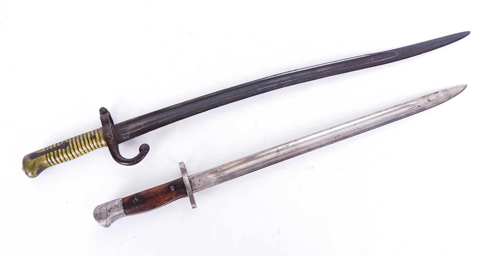 Bayonet Lot: Lot (2) bayonets, (21 3/4" L., 27 1/4" L.).