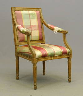 Early French Armchair: Early French upholstered armchair. Fluted legs, reeded arms. 18" seat Ht., 37" overall Ht..