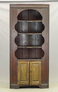 19th c. Corner Cupboard: 19th c. one piece corner cupboard. Open top with unusual extended shelves. Carved sides, barrel back. 43" x 27" x 92" Ht..