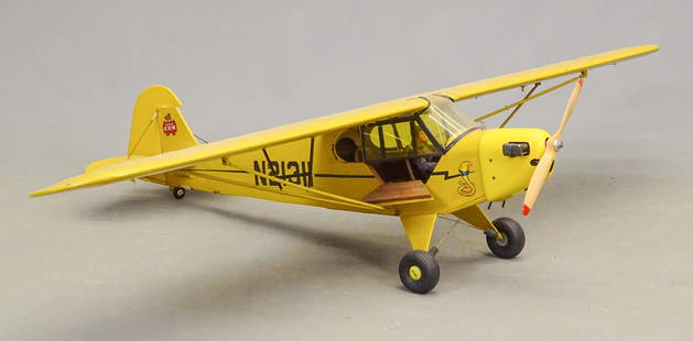 Airplane Model: Airplane model. C. 1950's J-3 Piper Cub with engine. 69 1/2" wing span, 43" L.. Imperfections.