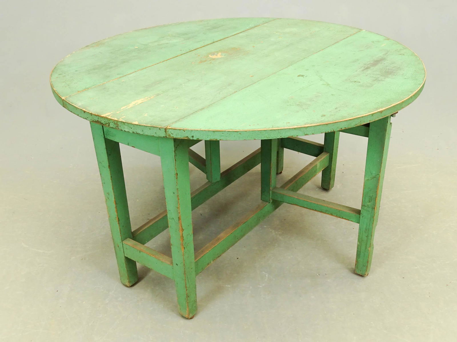 19th c. Dropleaf Table: 19th c. dropleaf table in green paint. 38" x 12" with 13" leaves, 22 1/2" Ht..