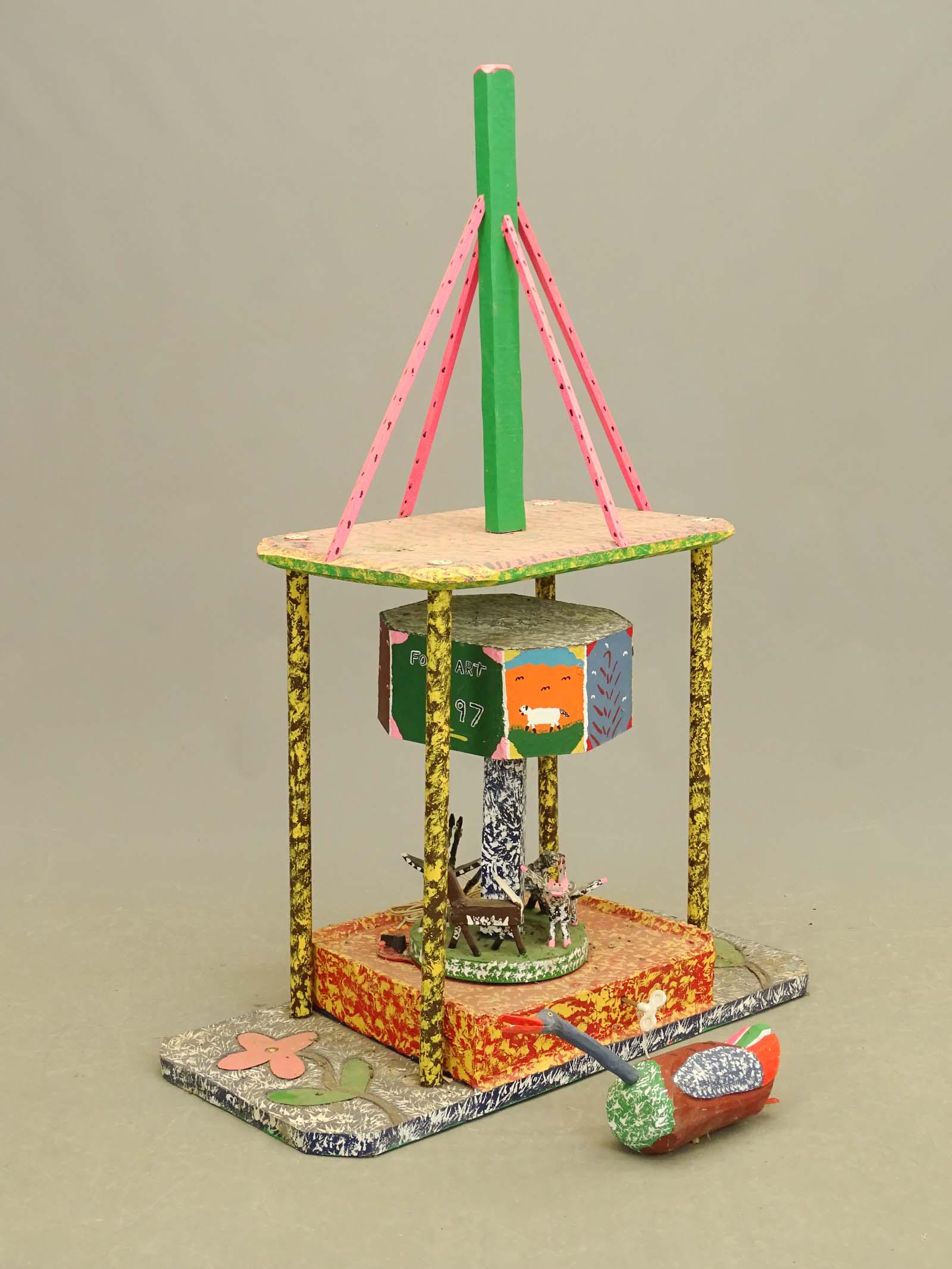 Leo Naugler Folk Art: Leo Naugler Nova Scotia folk art sculpture. Plugs in and plays music and revolves. 28" x 14" x 50 1/2" Ht.. Bird finial detached.