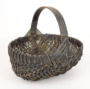 19th c. Basket: 19th c. Melon form basket in black paint. Black ash. 10" x 8" x 9".