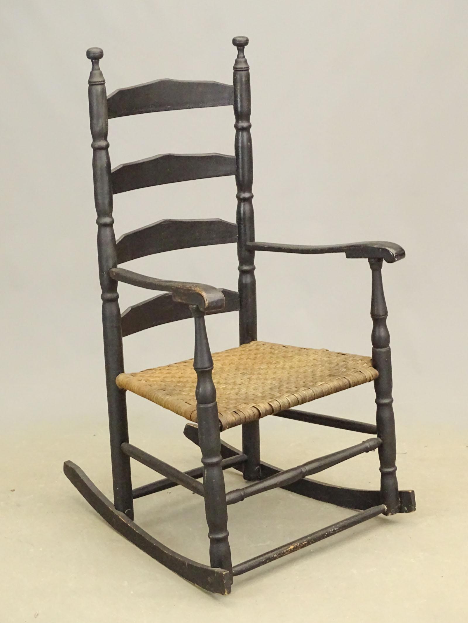 18th c. Rocking Chair: 18th c. ladderback rocking chair with splint seat. Black paint. 15 1/2" seat Ht., 44" overall Ht..
