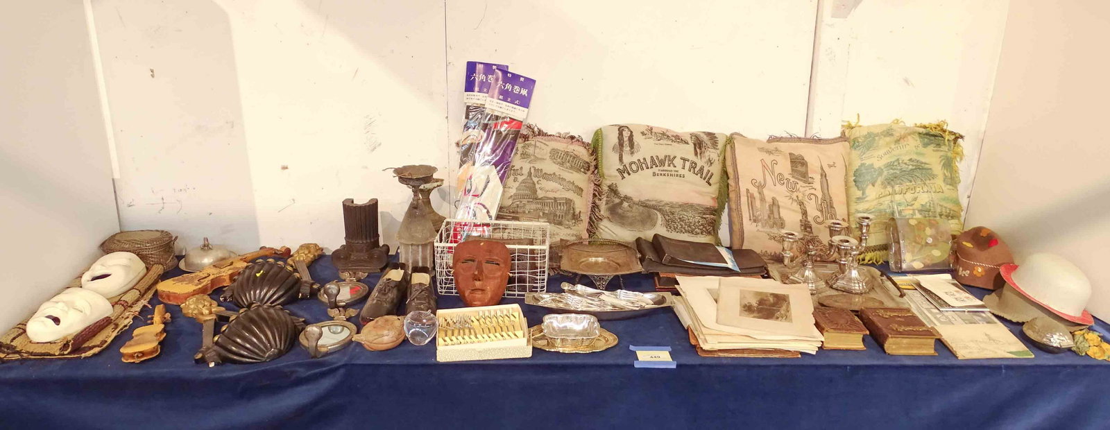 Misc. Lot: Misc. lot including composition theater masks, hooked rug, sconces, composition wall pockets, silverware, lanterns, prints, vintage pillows etc..