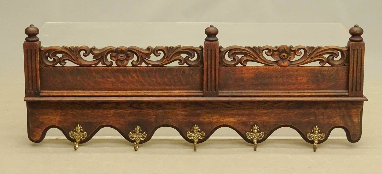 Continental Oak Hook Rack: Continental oak hook rack with brass figural hooks. 40 1/2" x 13 1/2".