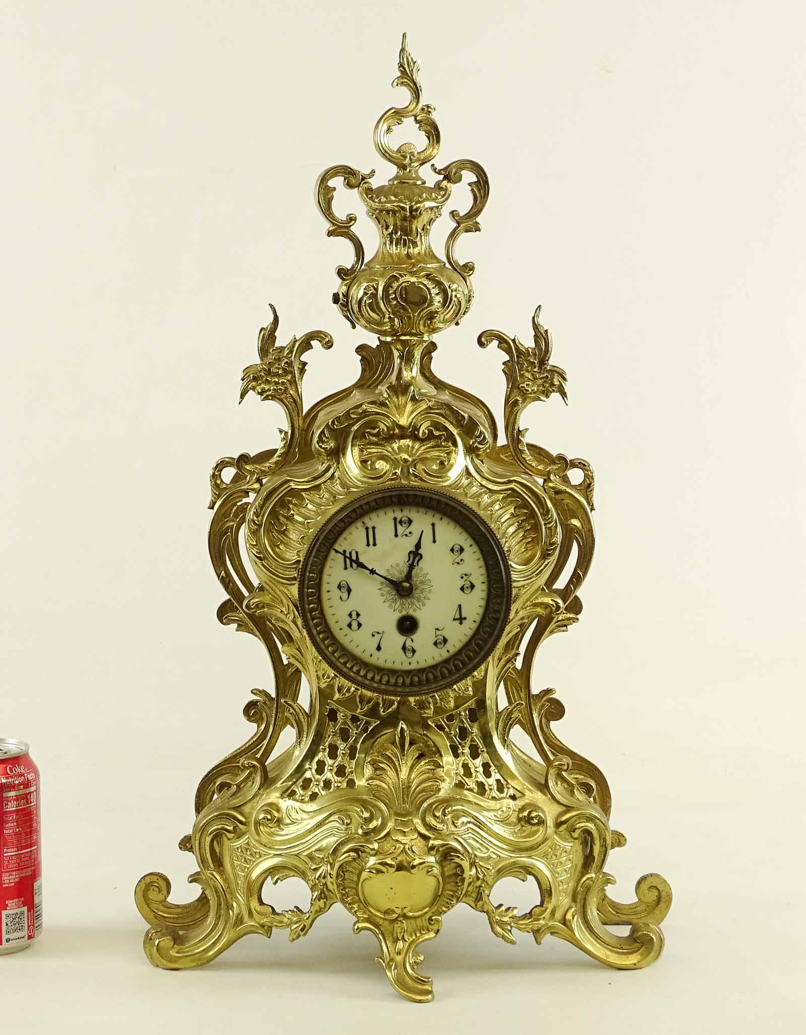 Continental Brass Clock: Fancy Continental brass clock. 13 1/4" x 4" x 22 3/4". Retains pendulum.