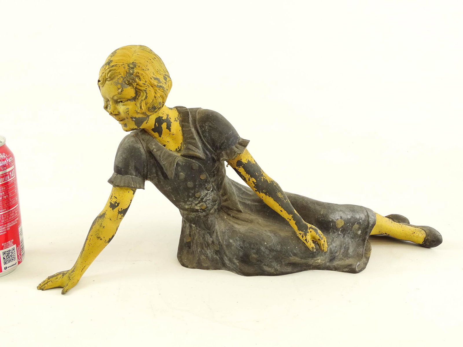 Pot Metal Statue: Pot metal statue of a reclining woman. 14 1/2" x 8 1/2".