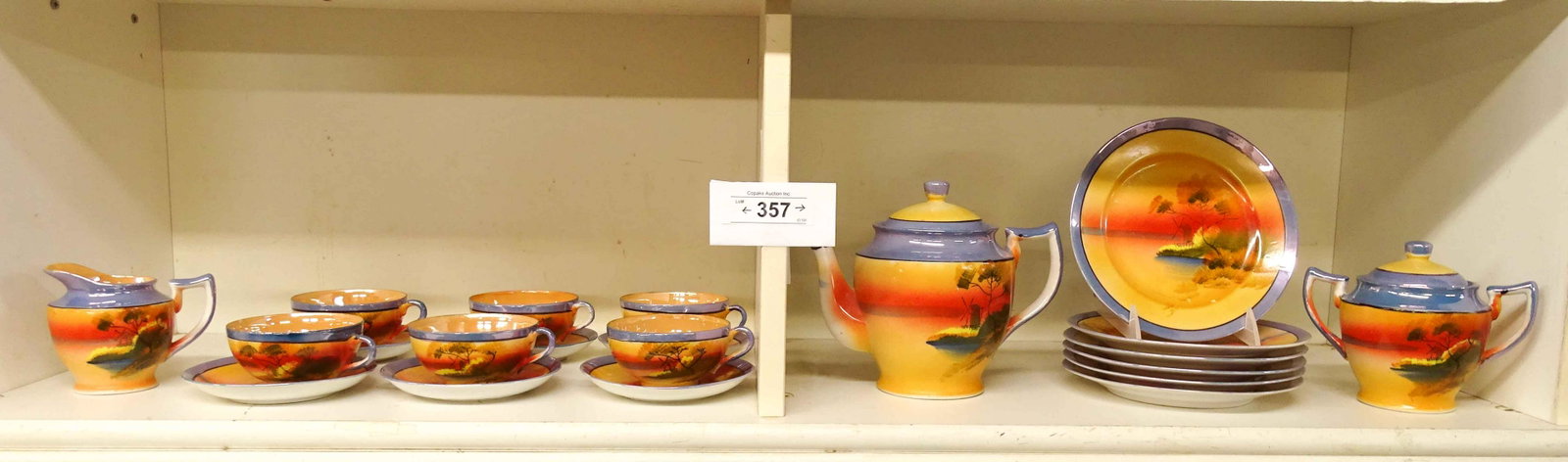 Japanese Tea Set: Vintage Japanese tea set including (6) cups and saucers, teapot, cream, sugar and ((6) 7 1/4" plates.