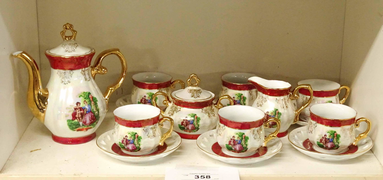 Japanese Tea Set: Vintage Japanese tea set including (6) cups and saucers, teapot, cream and sugar.