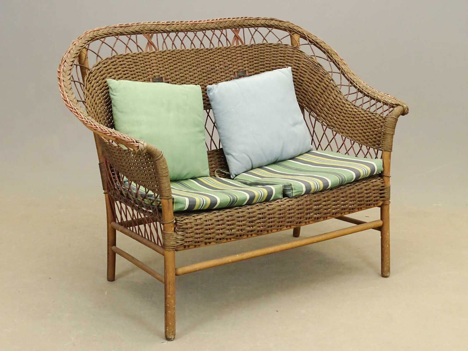 Wicker Settee: Vintage wicker settee. 48" W..
