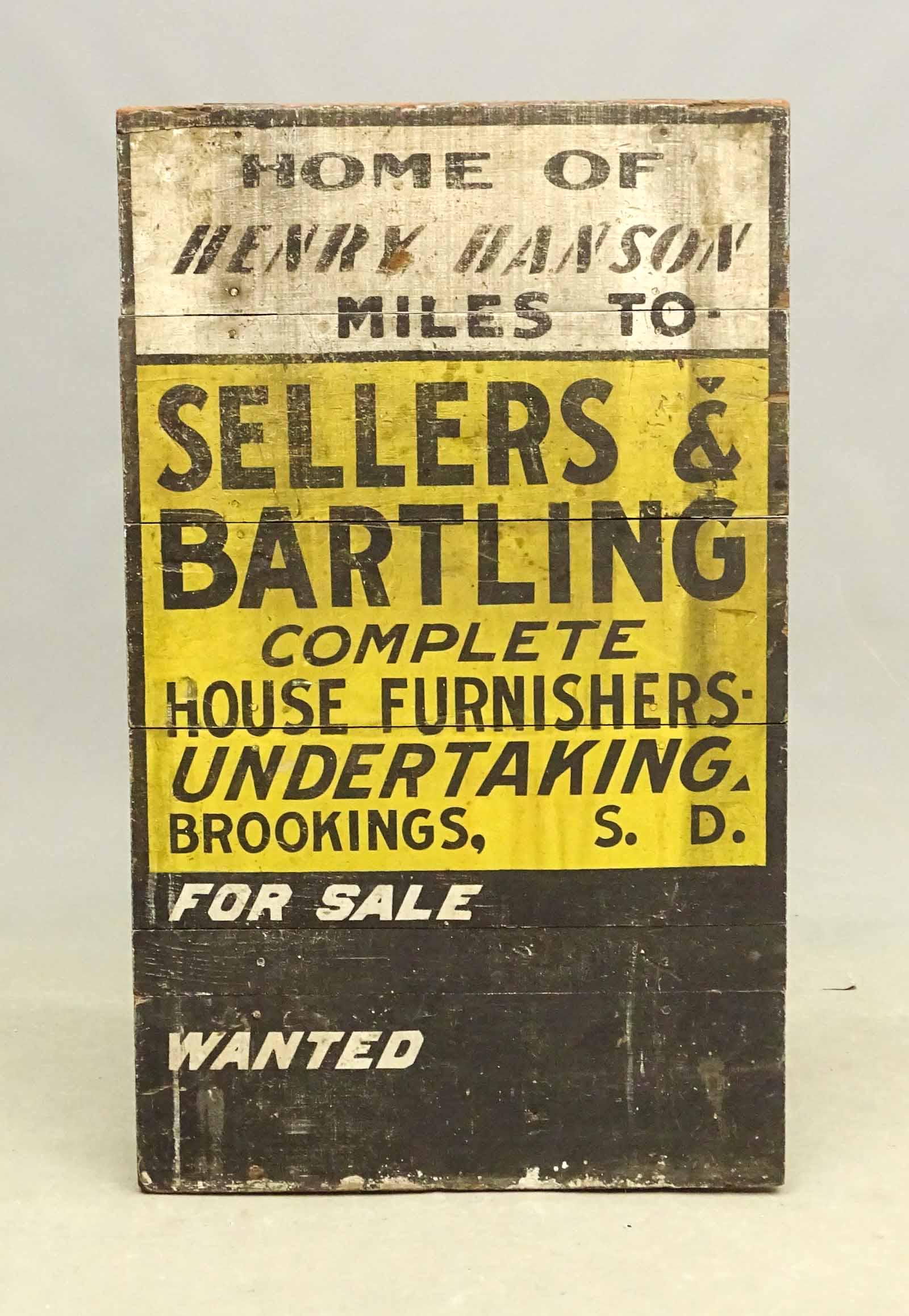 Trade Sign: Early painted wooden trade sign "HOME OF / HENRY HANSON / MILES TO / SELLERS & / BARTLING / COMPLETE / HOME FURNISHERS / UNDERTAKING...". 40" x 24".