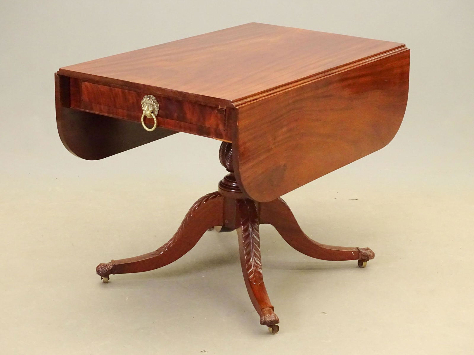 19th c. New York Breakfast Table: Early 19th c. New York carved mahogany Duncan Phyfe type breakfast table. 38 1/2" x 24 1/2" with 11" leaves, 28 1/2" Ht..