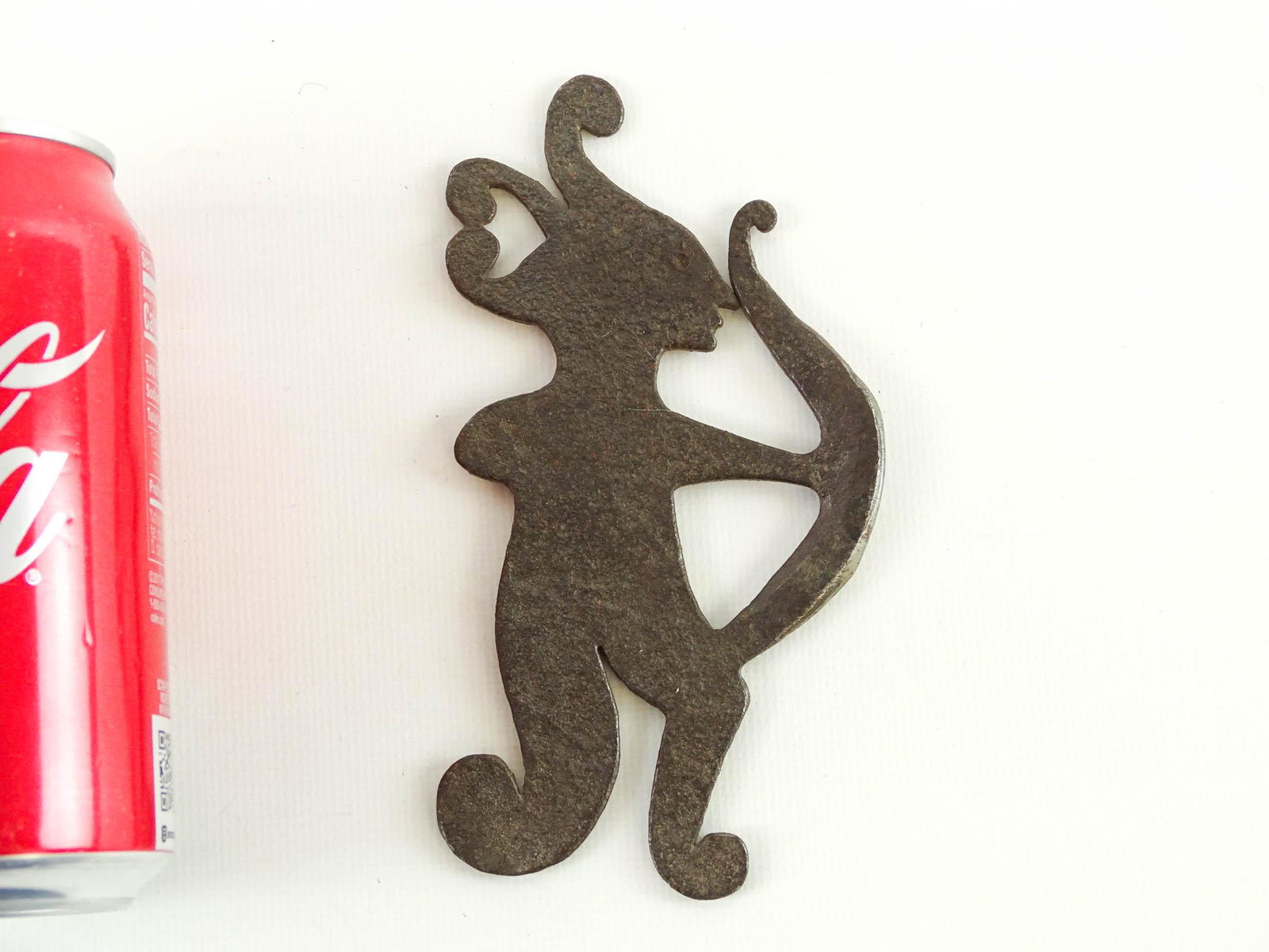 Flint Striker: Iron flint striker in the form of a Native American. 5 1/2" L..