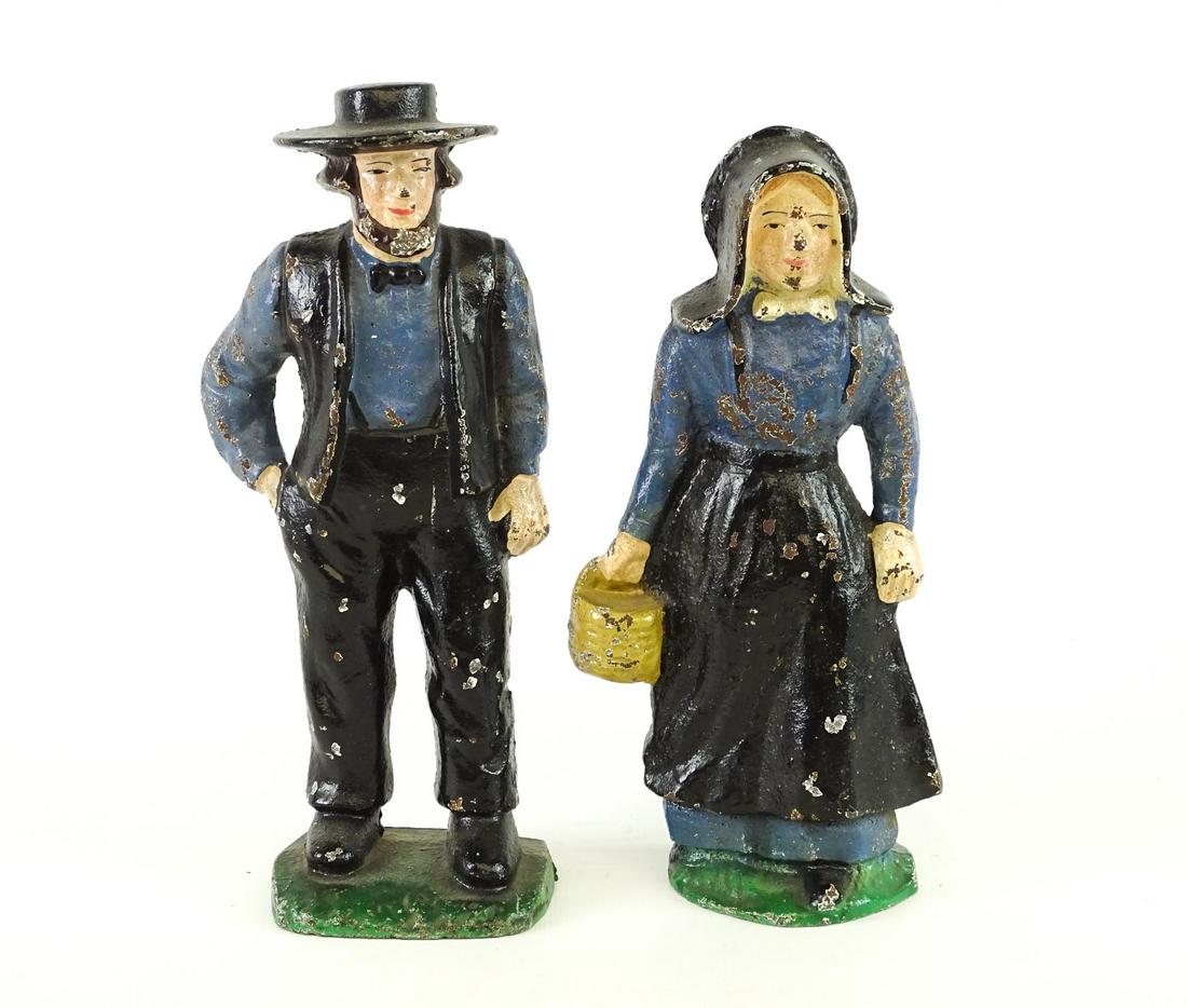 Amish Doorstops: Pair cast iron painted Amish doorstops. 9" Ht..