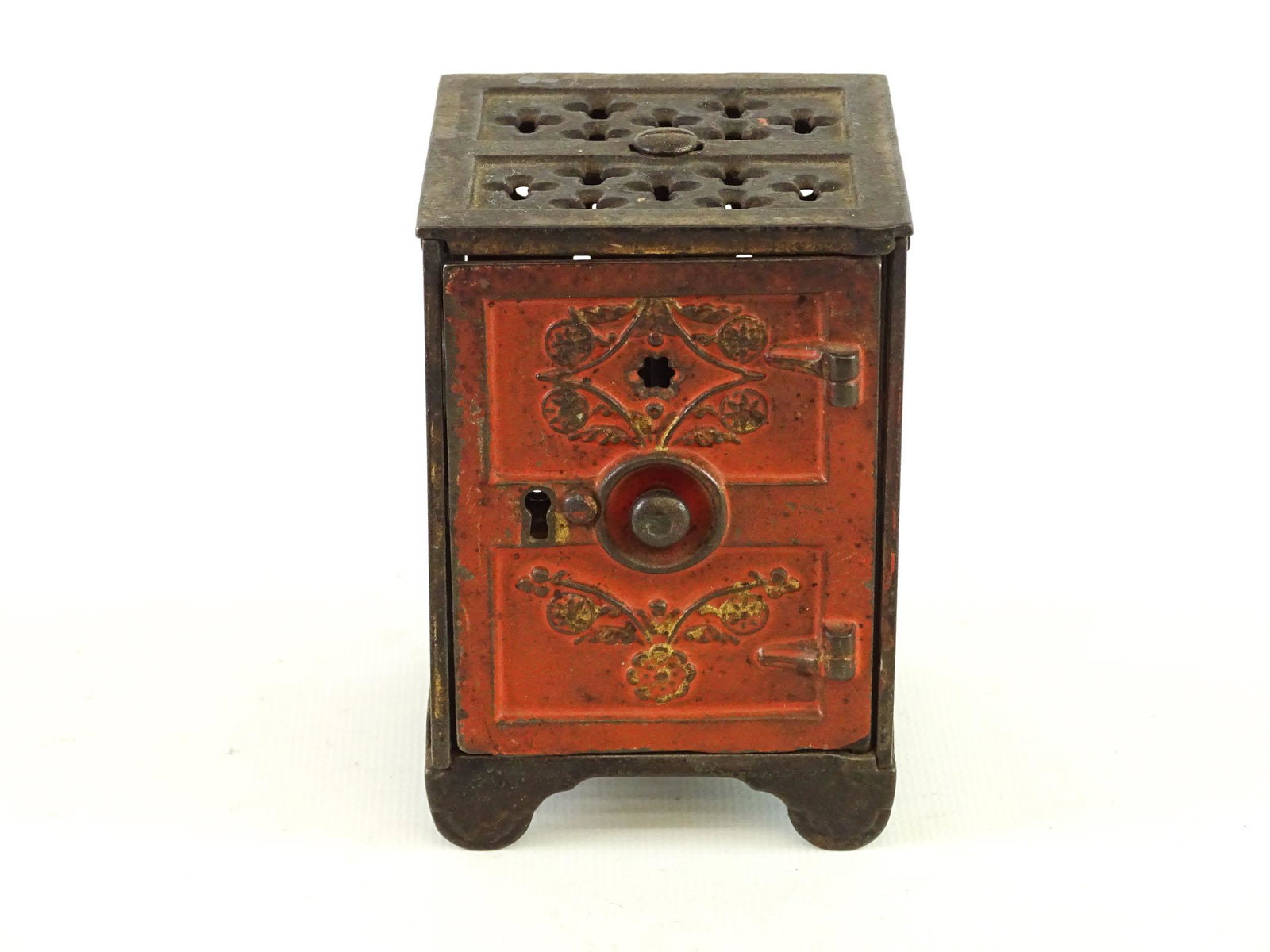 Safe Bank: C. 1897 Rosette Safe bank. Stevens & Shimmer. 2 3/4" x 3" x 4".