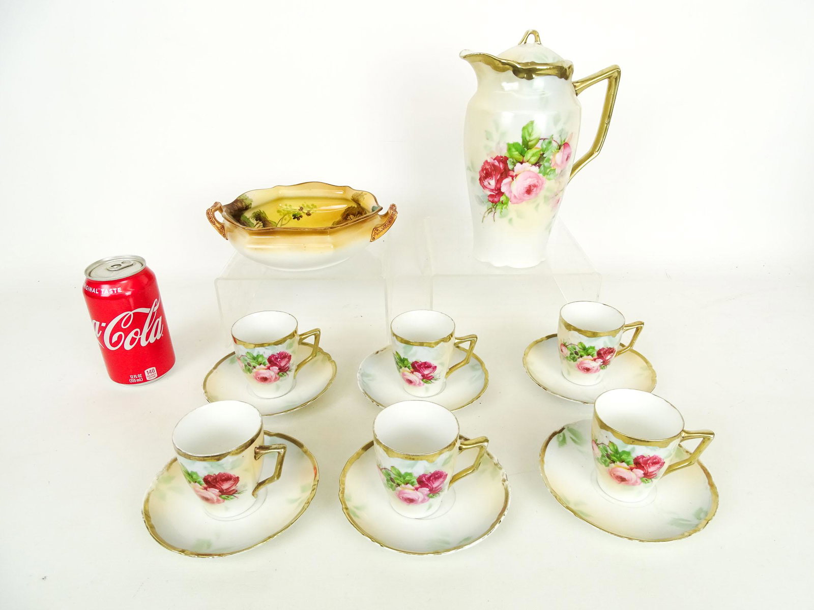 Porcelain Lot: Porcelain lot including teapot with (6) cups saucers, along with Noritake bowl.