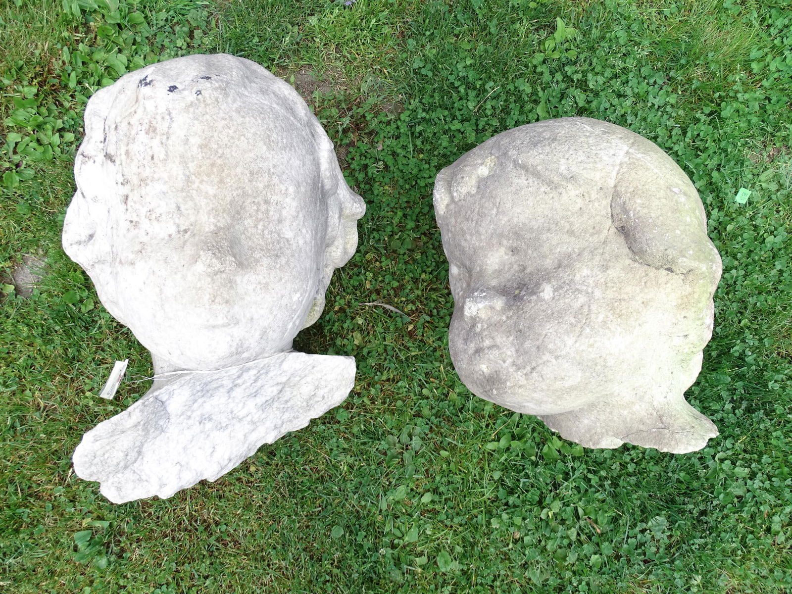 Pair Granite Sculptures: Pair granite sculpture elements, children's heads. Very heavy. Largest approx. 24" Ht..