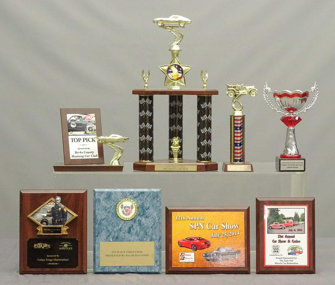 Car Trophy & Plaque Lot: Lot including Car trophies and plaques.