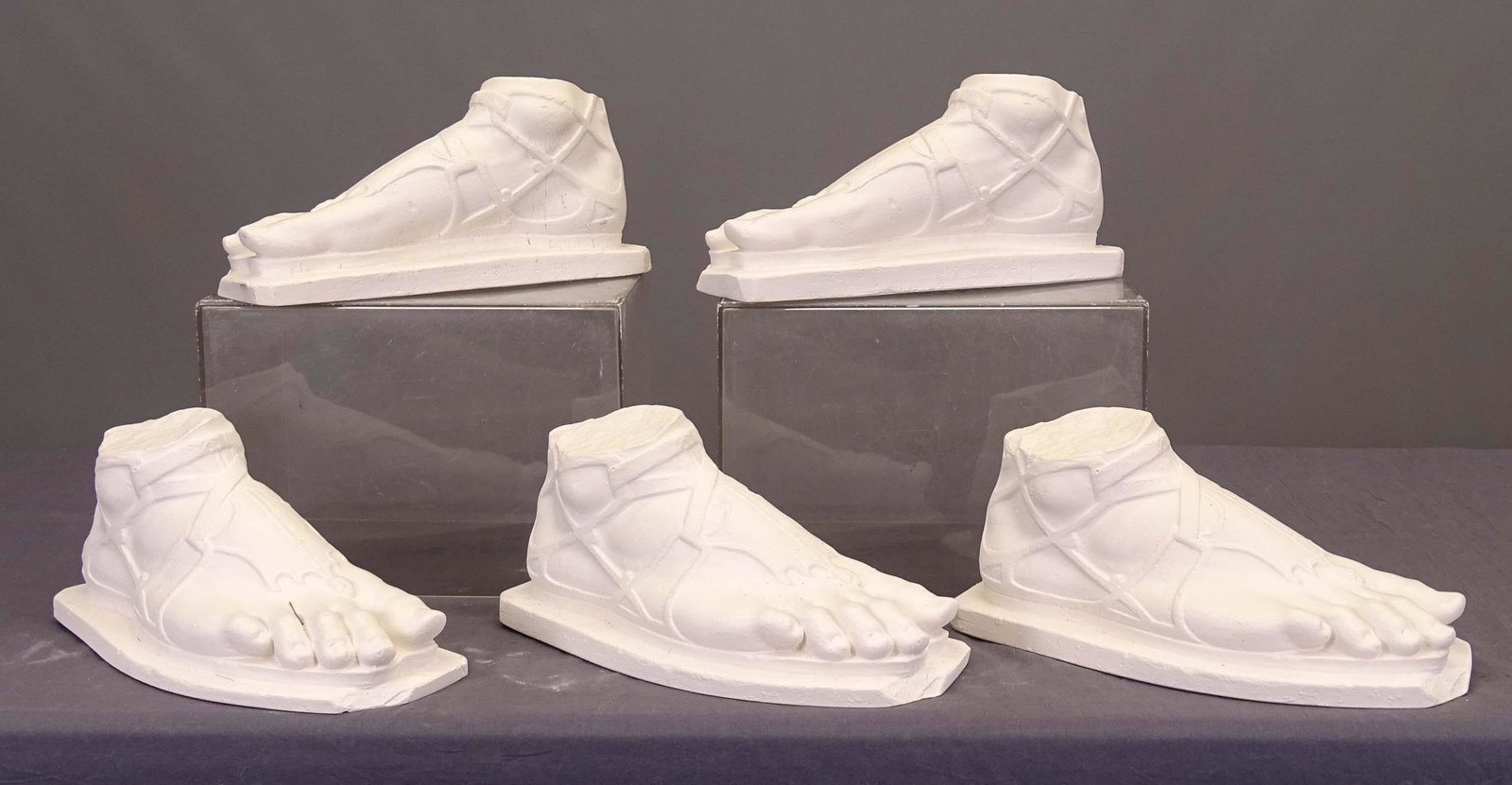 PJ Hone (London 20th Century), Plaster Feet: PJ Hone (London 20th Century), (5) plaster feet. Approx. 13" L..