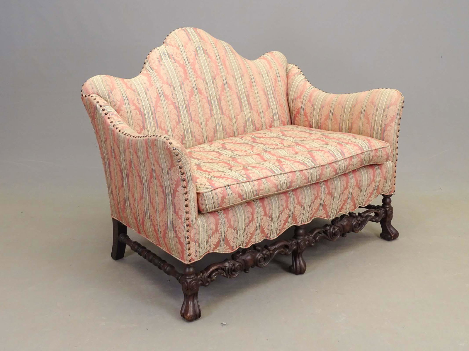 Settee: Decorative carved and upholstered settee. 49" x 29" x 27 1/2".