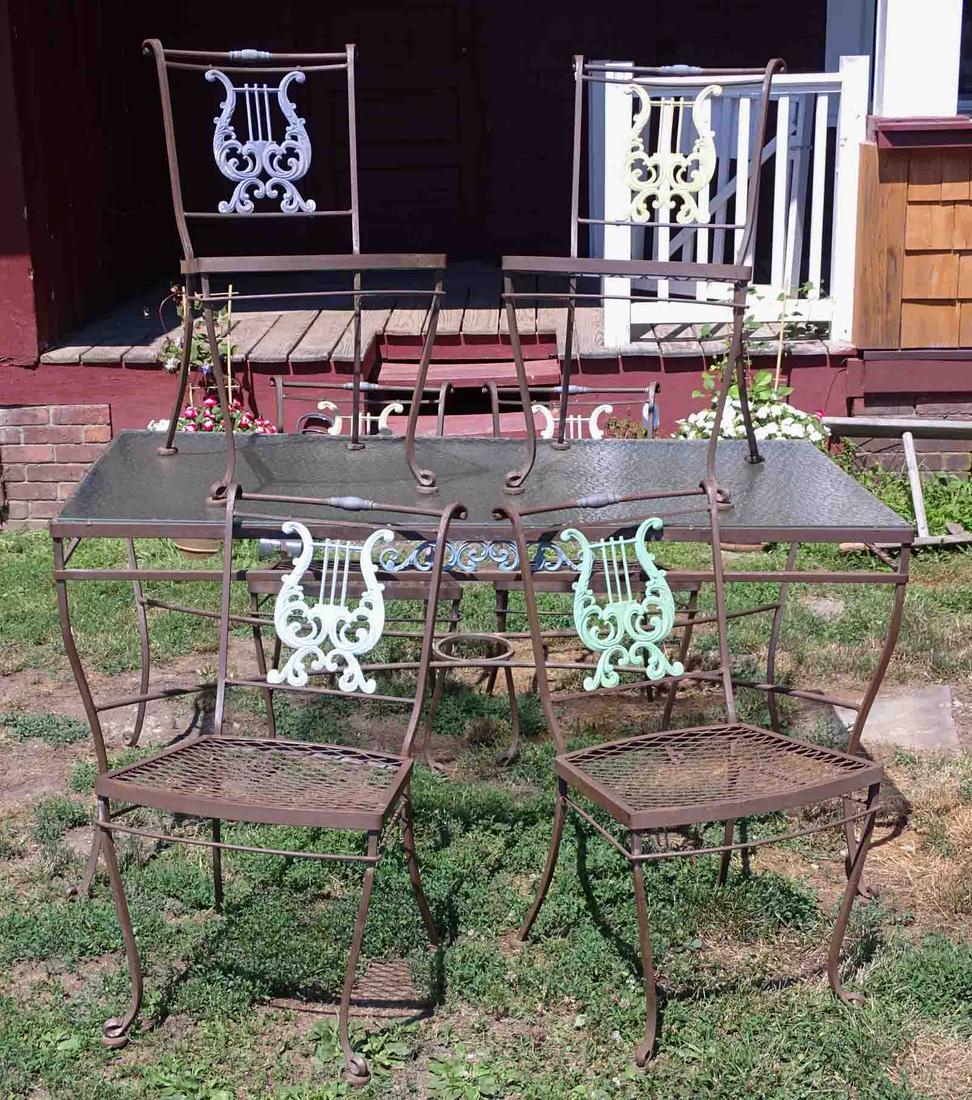 Patio Table and Chairs: Glass top patio table with (6) Lyre back chairs.