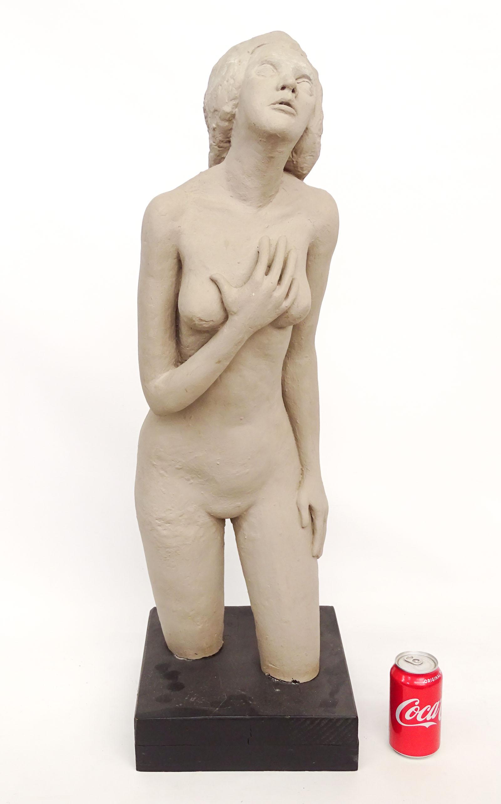 Sculpture of a Woman: Plaster sculpture of a woman on wooden base. 10 1/2" x 11" x 35".