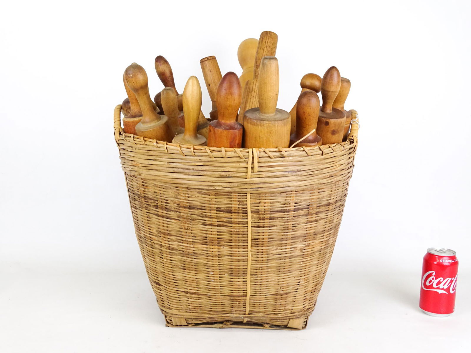 Rolling Pin Collection: Collection of various rolling pins in basket.
