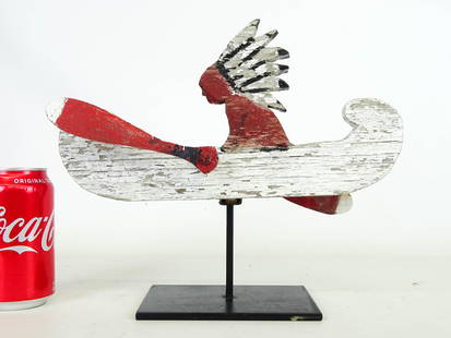 Whirligig: Painted whirligig Native American figure in canoe. Stand included. 12" x 6".