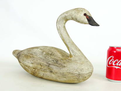 Swan Decoy: C. 1984 wooden painted Swan decoy. Signed Susan Anne Madsen, dated 1984 (her final year with Wildfowler), stamped "Wildfowler, Bablyon, NY" underside. 15 1/2" x 10 1/4".
