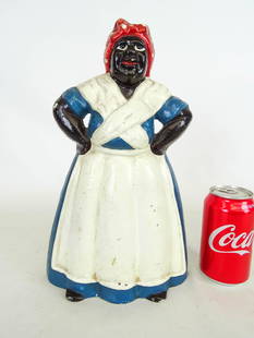 Doorstop: C. 1920 cast iron Mammy doorstop. Littco Products, Littlestown, Penna.. Ref: The Doorstop Book, Smith, p..218. 8" x 13".