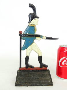 Soldier Doorstop: C. 1920 cast iron Soldier doorstop embossed "LITTLE HASKELL, HAGERSTOWN, MD. 1789". Depicts famous weathervane from Hagerstown. Ref: The Doorstop Book, Smith, p..224. 5" x 3" x 11".