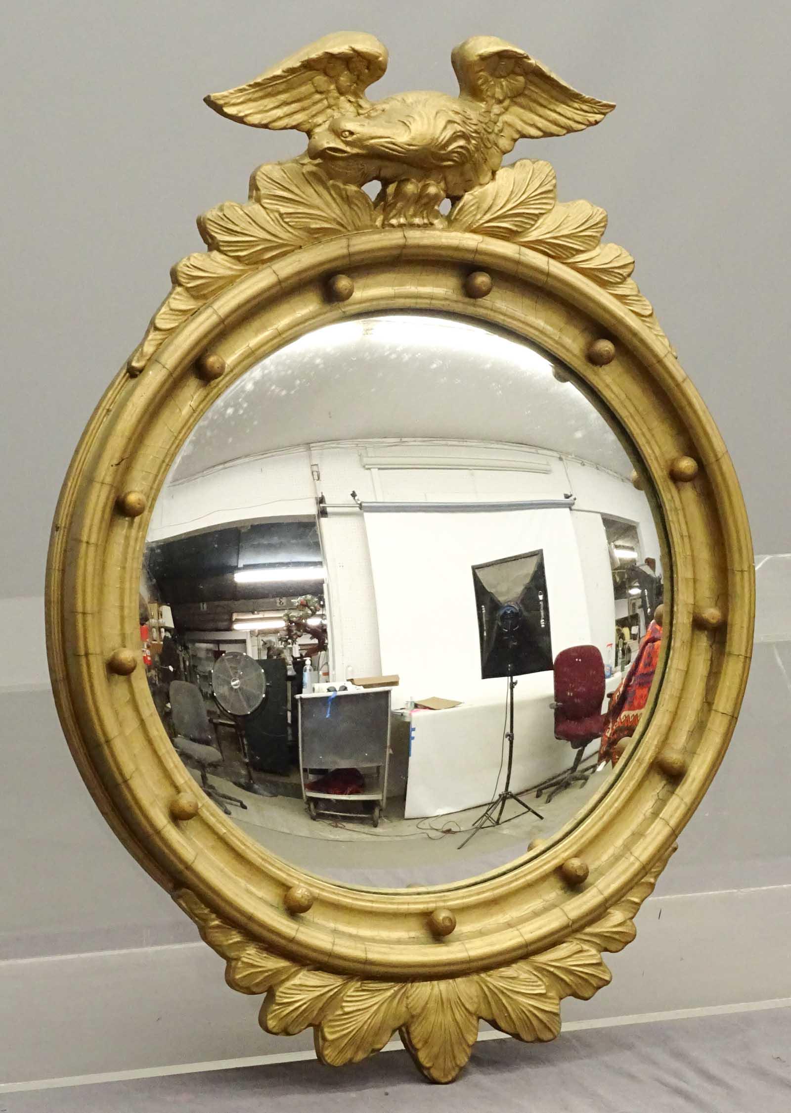 Bullseye Mirror: Bullseye mirror with eagle top. 22" x 29 1/2".
