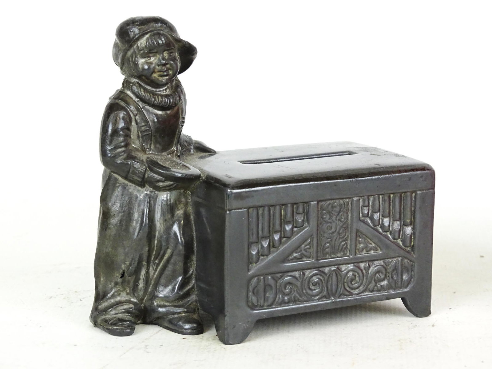 Bank: Lead bank "Jackie Coogan with Chest". C. 1925. 3" W., 3 1/2" Ht..